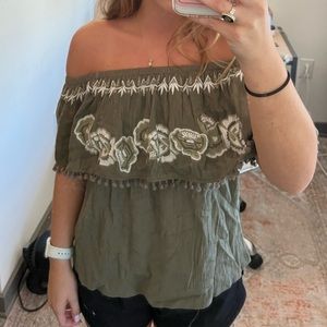 Francesca’s green ruffle off-the-shoulder top